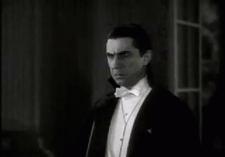 Dracula imposing a little mind control over his victim, dinner time animated gif image