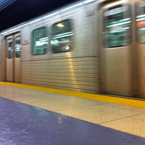 Photorealistic cinemagram of a never ending subway train passing by in the night