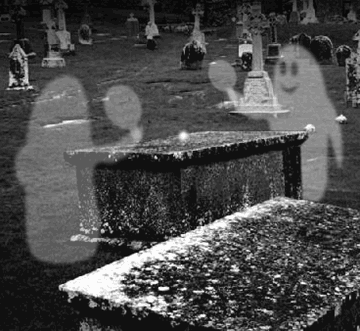 Friendly little afterlife game of ping pong with a couple of ghosts in a cemetery