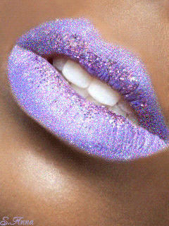 Purple glittering lips hiding a girl's pearly white