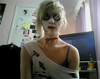 Creepy zombie looking girl lunges for your throat in this short animated  gif image