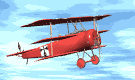 Animated clip art image of Red Baron's biplane flying in the blue sky