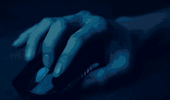 Girls fingers moving on mouse under blue light