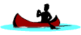 Silhouette of a man paddling a canoe on a lake