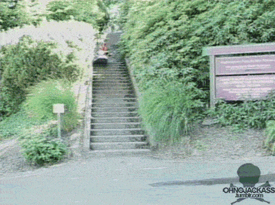Man demonstrates unconventional use of a kayak to quickly descend a set of stairs