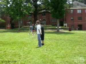 Moving animated gif with two kids getting bowled over with a giant soccer ball