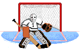 Hockey goalie in white jersey, mask and protective gear defending the net from the opposing team