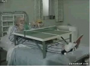 Hospital patient finds a way to get some exercise and a little entertainment playing table tennis with his feet as his opponent