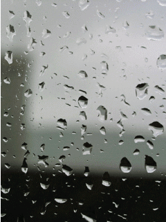 Animated raindrops running down a widow pane
